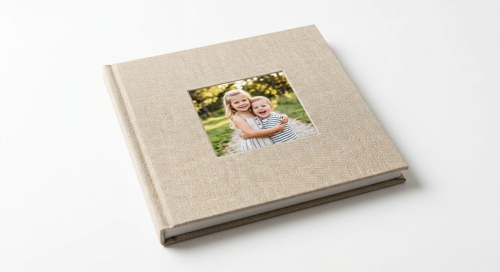 A closed linen hardcover photo book with two children on the cover